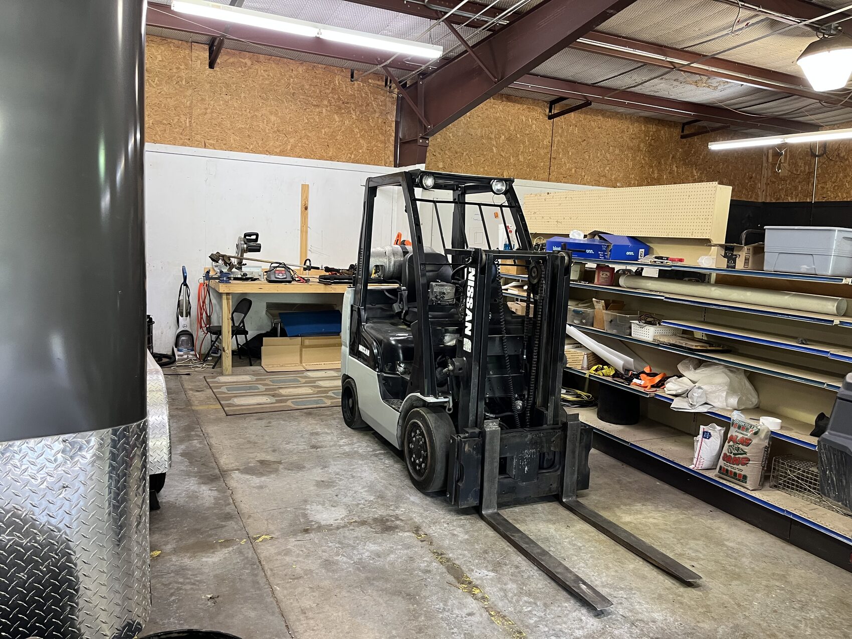 Forklift and racking inside the shop