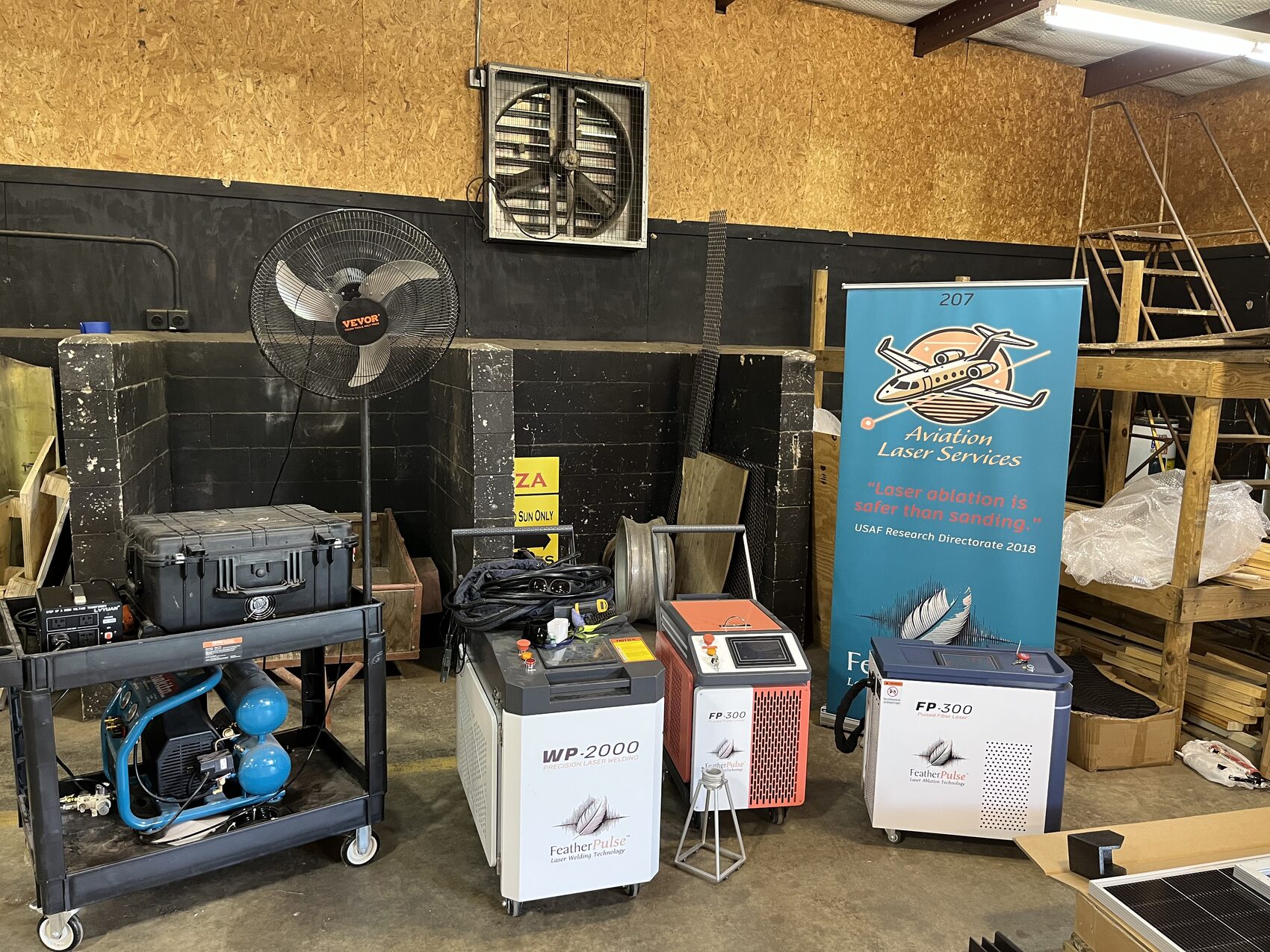 FP-300 laser units and benches inside the shop